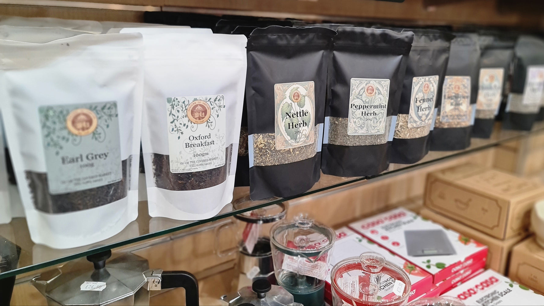 Assorted tea packages on a shelf in a store